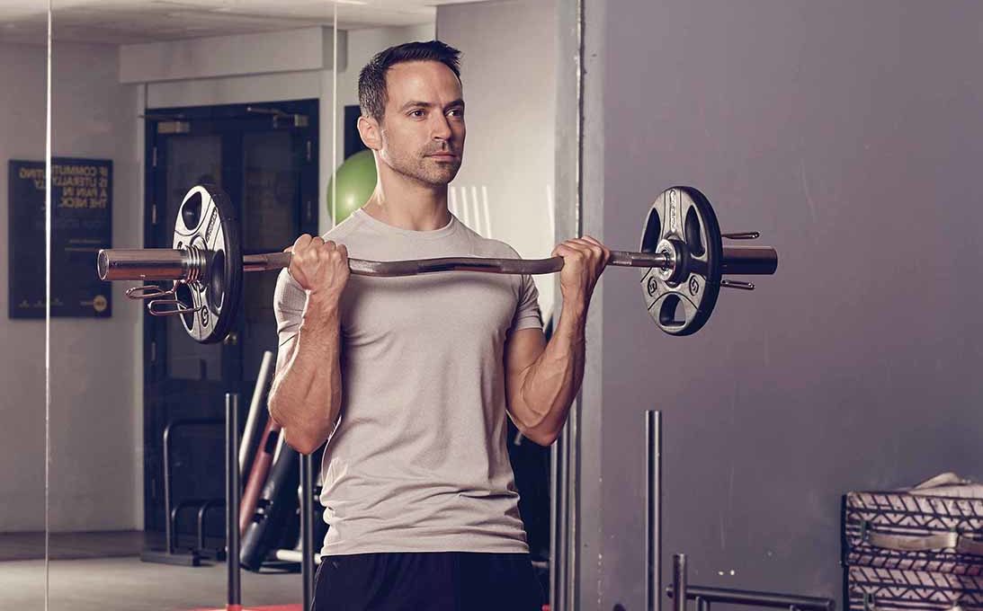 Use the EZ bar curls to build big and defined arms